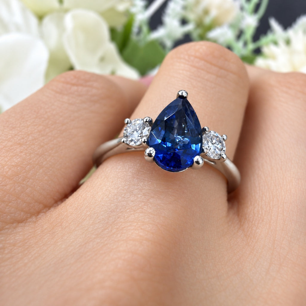 1.50Ct Blue Pear Sapphire & Side Round Diamond Three Stone Ring in 950 Platinum