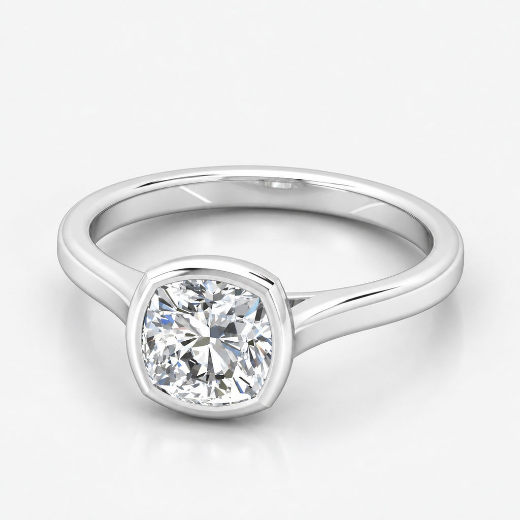 IGI Certified The Flow Cushion Diamond Solitaire Bezel Set Engagement Ring in Gold & Platinum