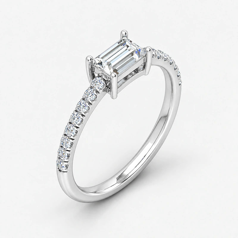 IGI Certified Lab Grown East-West Emerald Cut Diamond with Round Side Stones Claw & Pavé Engagement Ring in Gold & Platinum – 1–4Ct