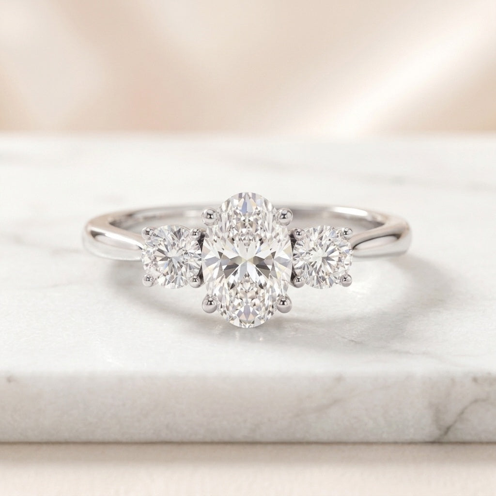 IGI Certified 3.00 Carat Oval & Round Lab Diamond Trilogy Ring - E/VS