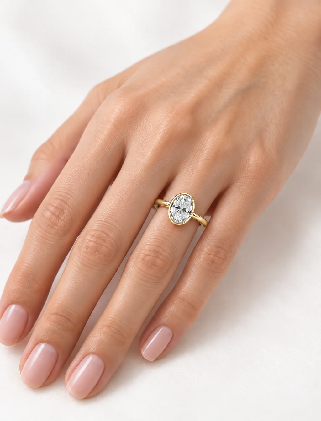 IGI Certified Lab Grown Oval Diamond Bezel Set Solitaire Engagement Ring in 18k Yellow Gold
