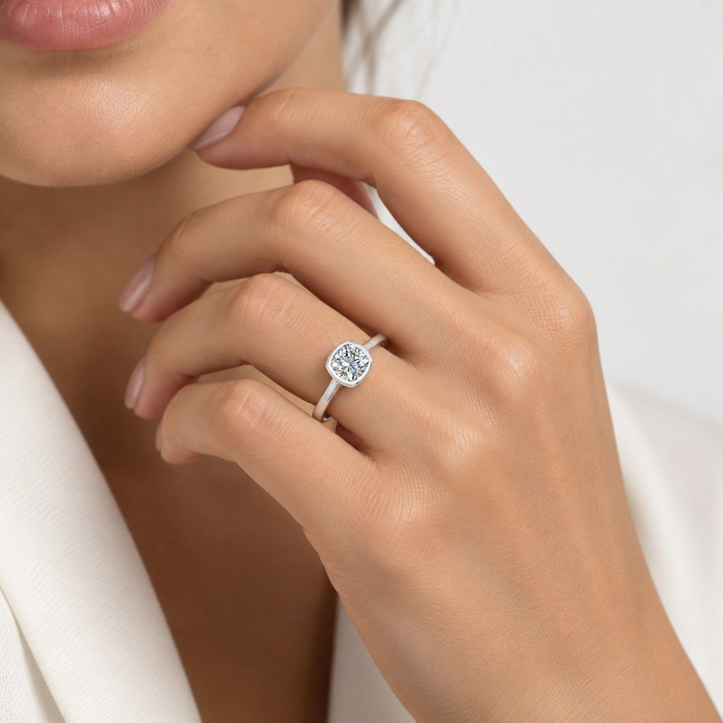 IGI Certified The Flow Cushion Diamond Solitaire Bezel Set Engagement Ring in Gold & Platinum