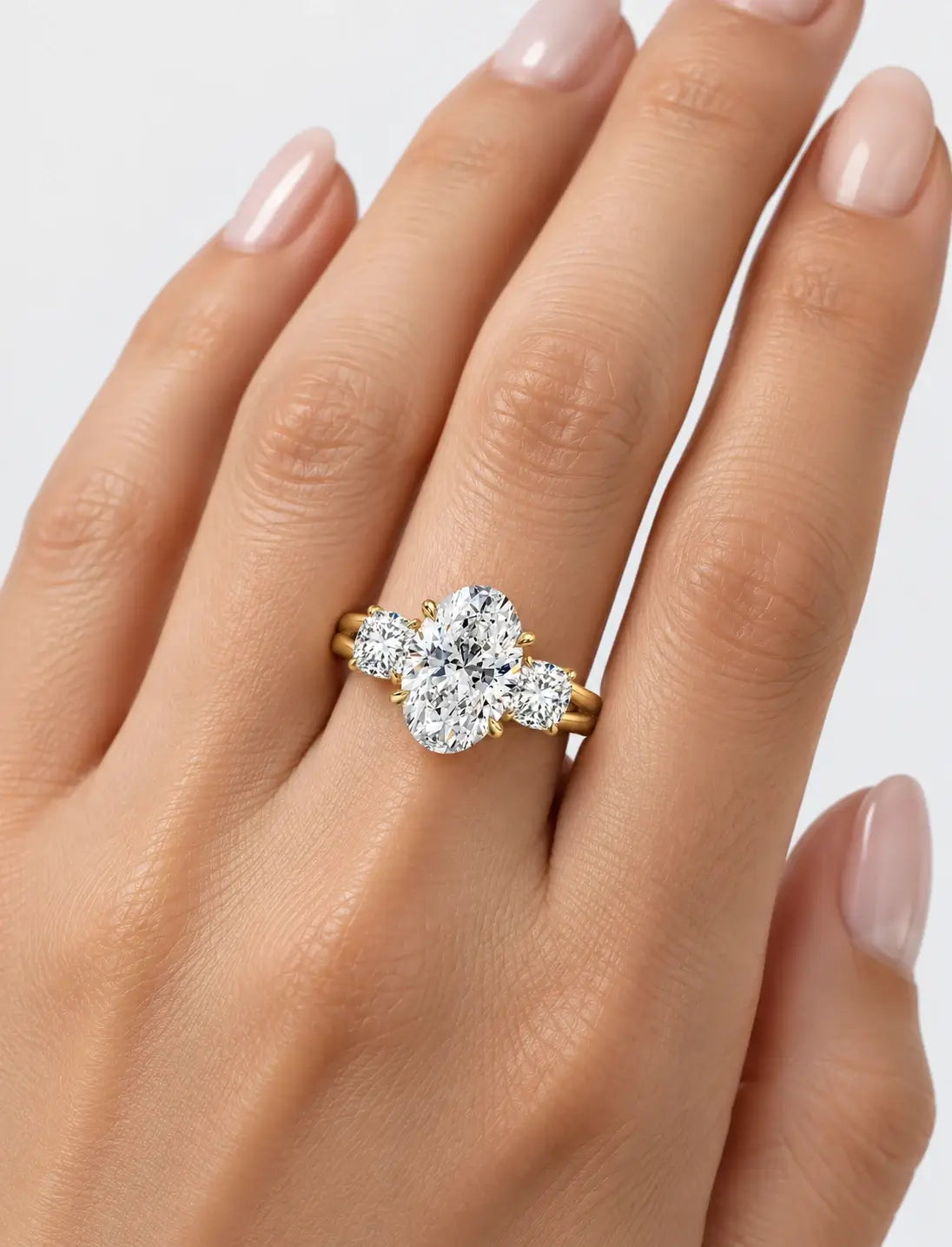 IGI Certified Lab Grown Oval Cut Diamond with Round Side Diamonds Three-Stone Engagement Ring in Gold & Platinum