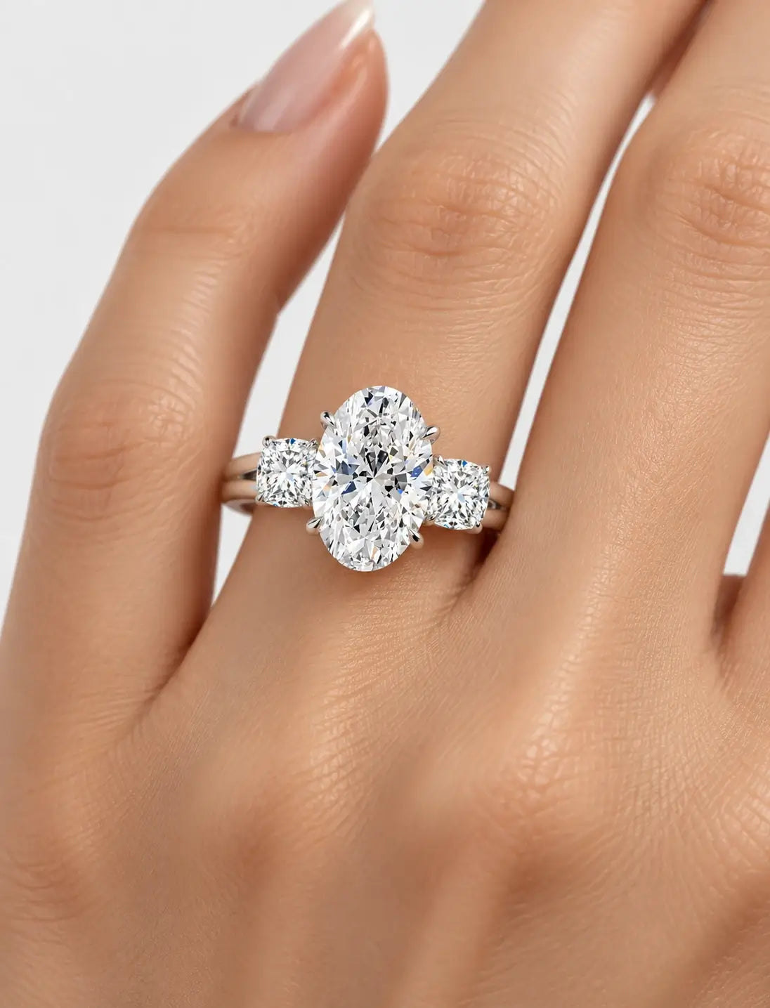 IGI Certified Lab Grown Oval Cut Diamond with Round Side Diamonds Three-Stone Engagement Ring in Gold & Platinum