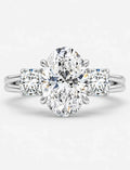 IGI Certified Lab Grown Oval Cut Diamond with Round Side Diamonds Three-Stone Engagement Ring in Gold & Platinum