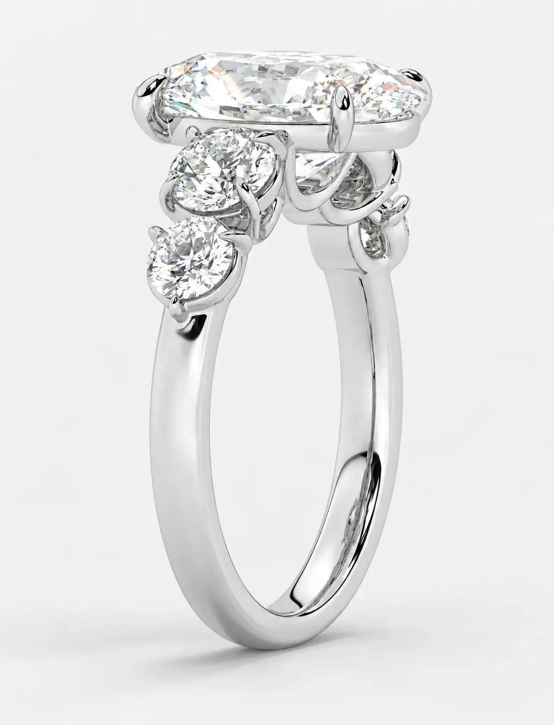 IGI Certified Lab Grown Oval Brilliant Diamond Solitaire Ring with Graduated Round Diamond Accents in Gold & Platinum