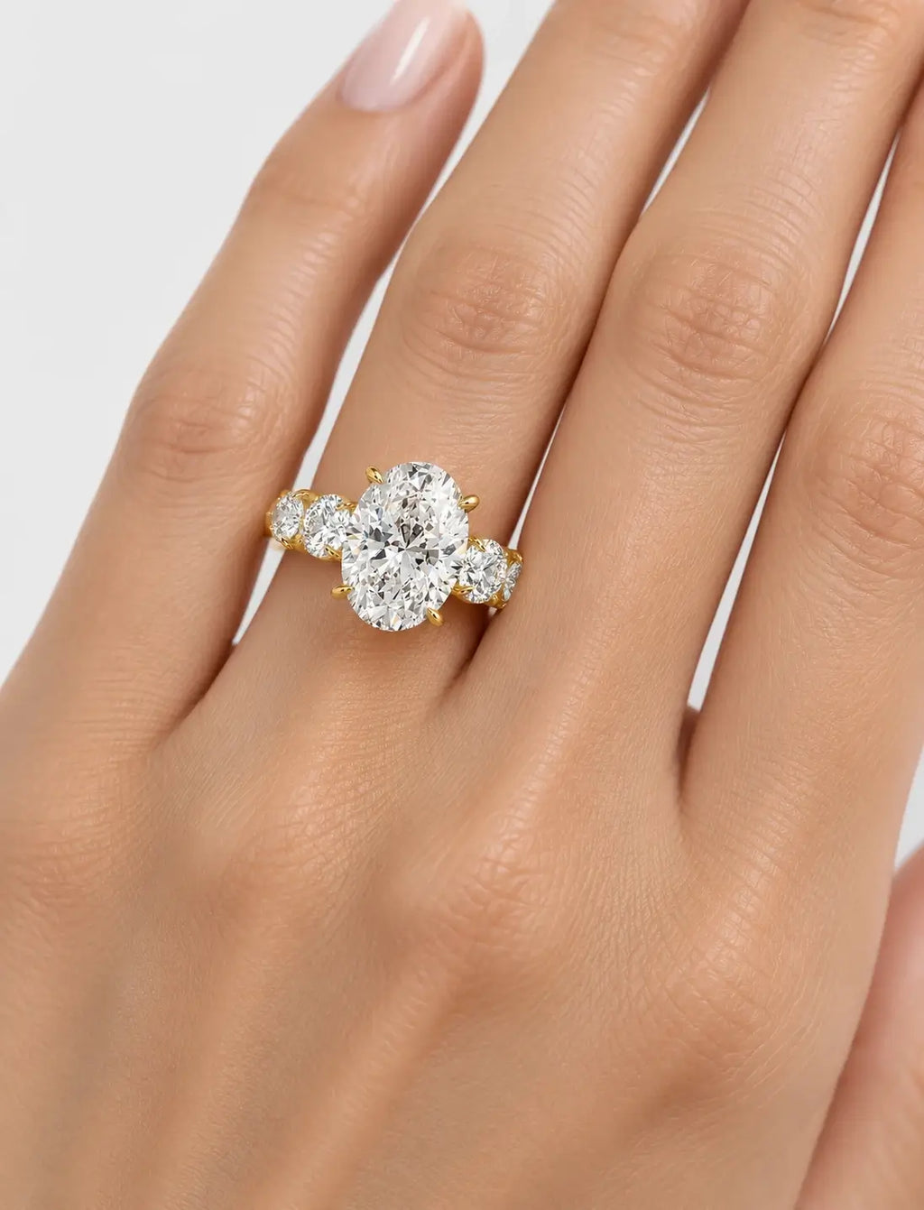 IGI Certified Lab Grown Oval Brilliant Diamond Solitaire Ring with Graduated Round Diamond Accents in Gold & Platinum