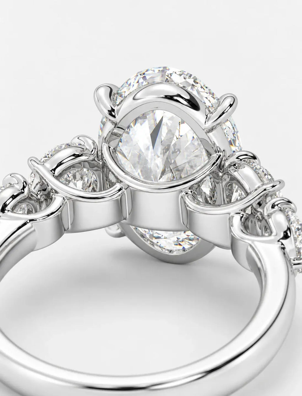 IGI Certified Lab Grown Oval Brilliant Diamond Solitaire Ring with Graduated Round Diamond Accents in Gold & Platinum