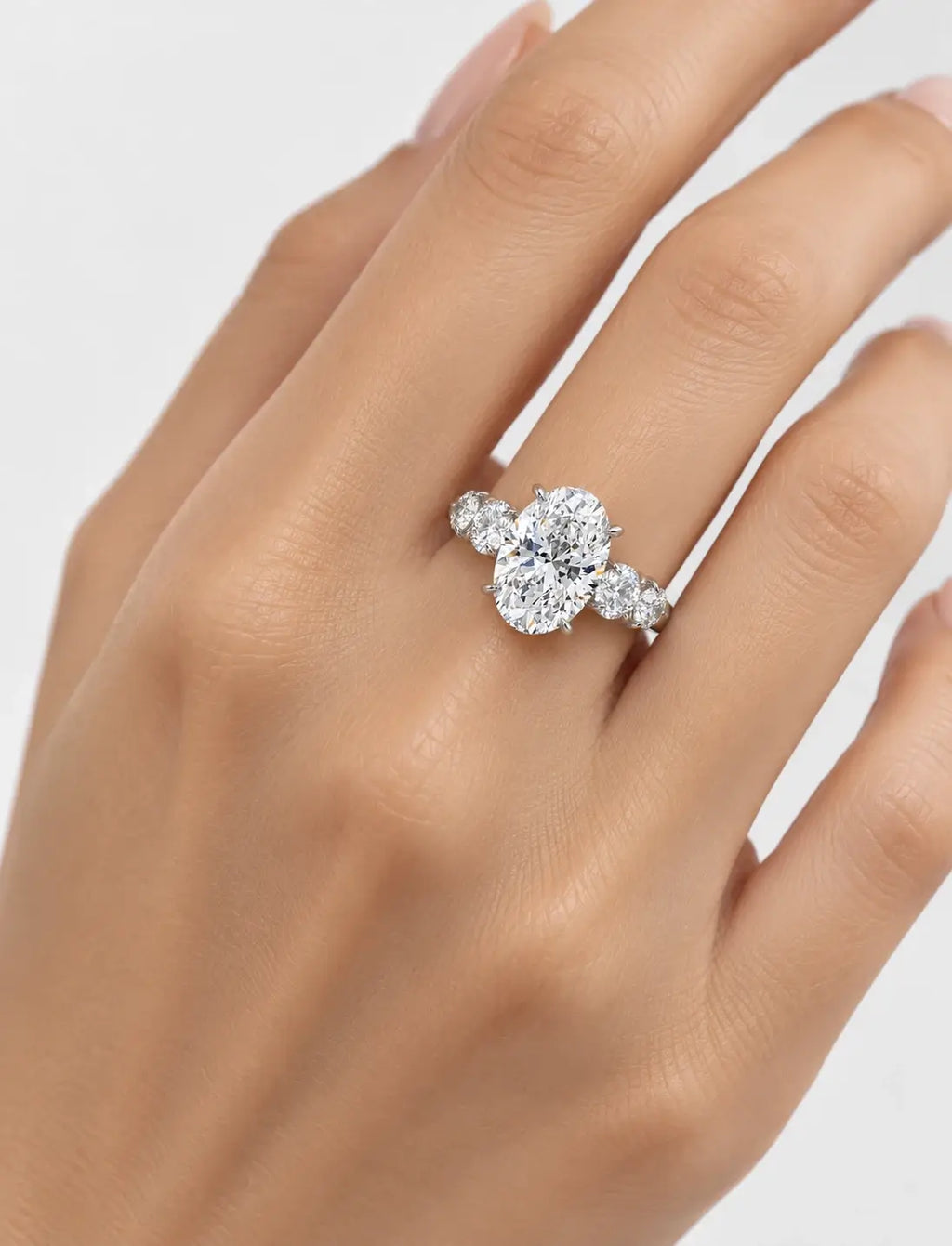 IGI Certified Lab Grown Oval Brilliant Diamond Solitaire Ring with Graduated Round Diamond Accents in Gold & Platinum