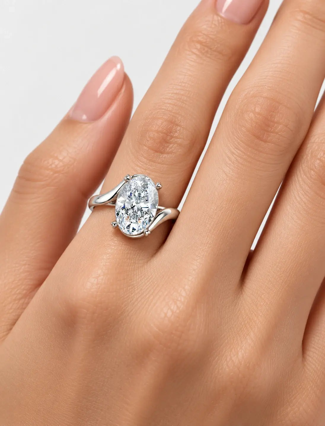 IGI Certified Lab Grown Oval Diamond Bypass Twist Solitaire Engagement Ring in Gold & Platinum