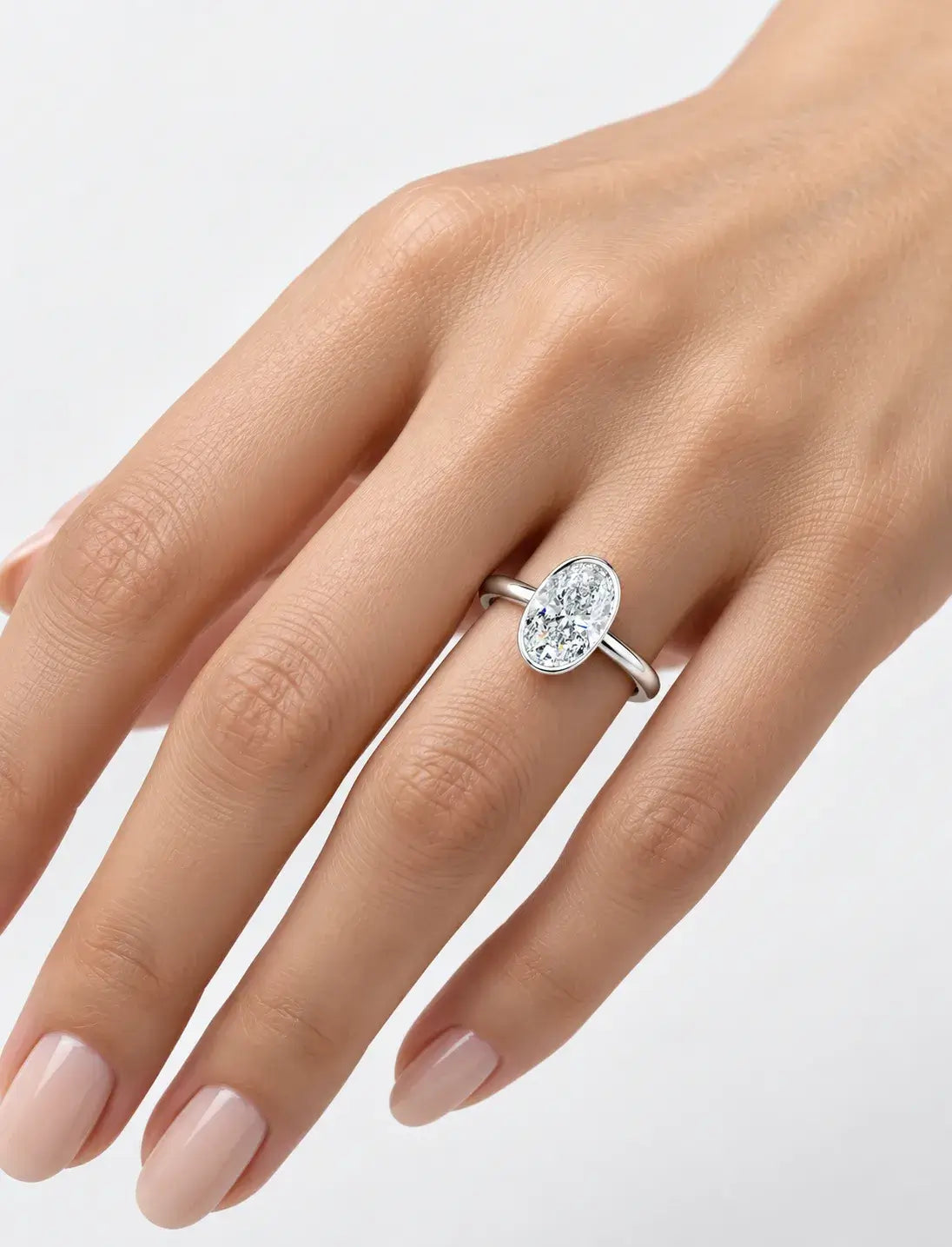 IGI Certified Lab-Grown Oval Bezel-Set Solitaire Engagement Ring in Gold & Platinum