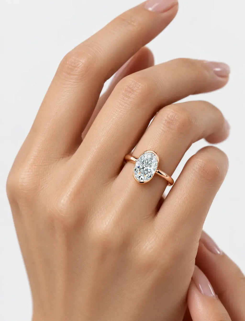IGI Certified Lab-Grown Oval Bezel-Set Solitaire Engagement Ring in Gold & Platinum