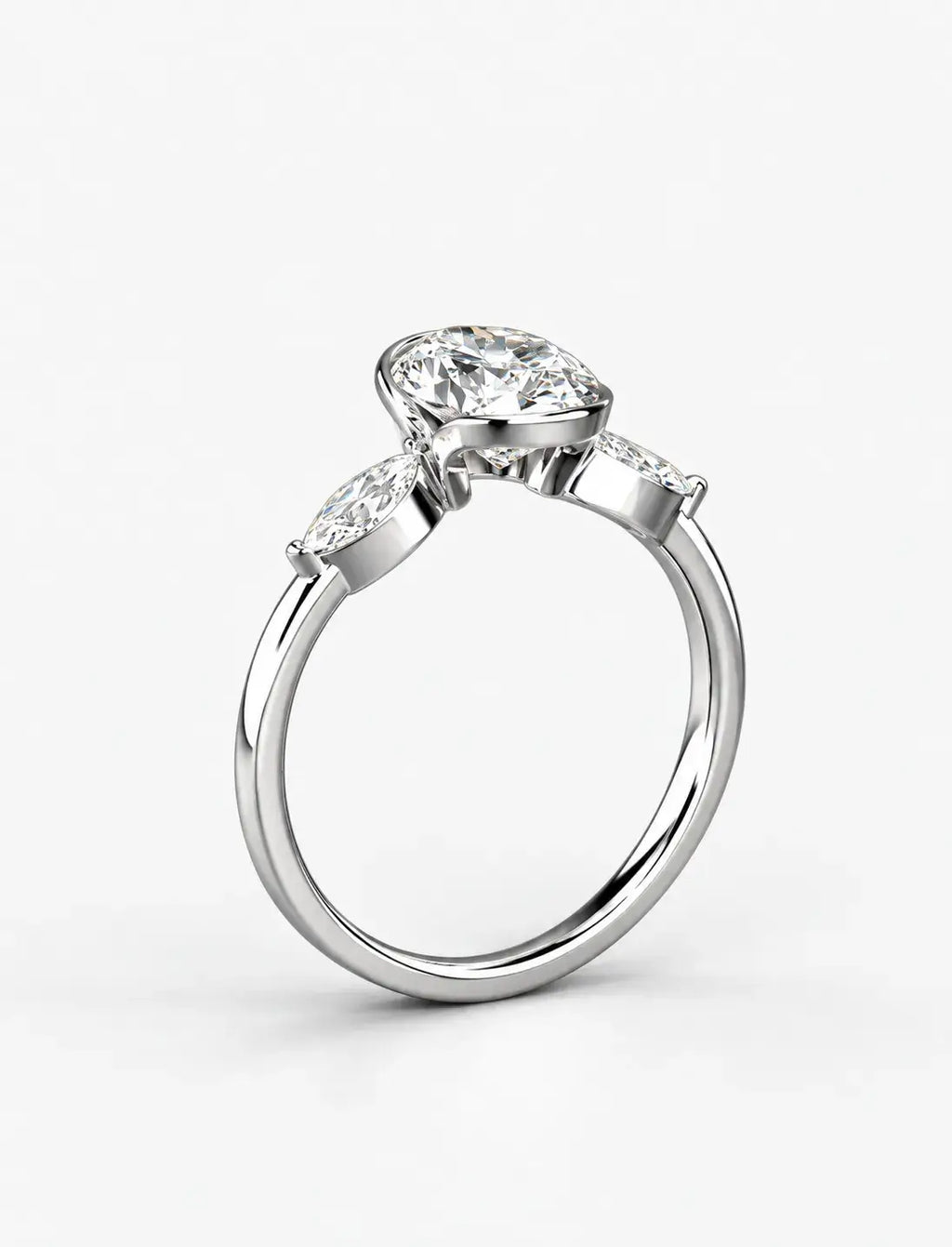 IGI Certified Lab Grown Oval Bezel Three-Stone Diamond Engagement Ring with Marquise Accents in Gold & Platinum