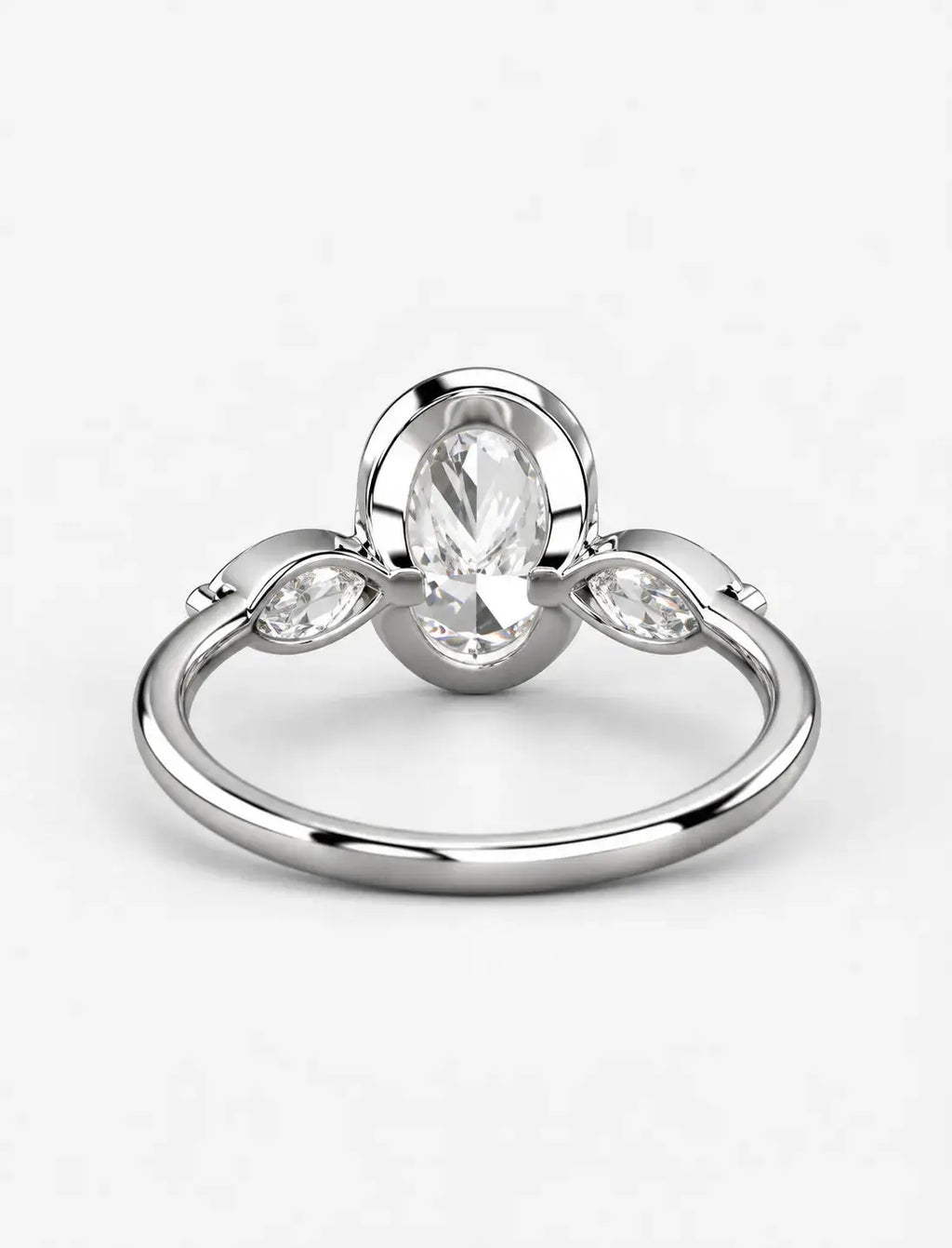 IGI Certified Lab Grown Oval Bezel Three-Stone Diamond Engagement Ring with Marquise Accents in Gold & Platinum