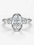 IGI Certified Lab Grown Oval Bezel Three-Stone Diamond Engagement Ring with Marquise Accents in Gold & Platinum