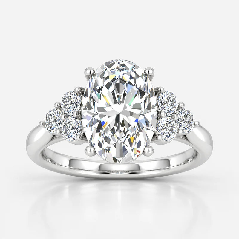 Oval-Cut Diamond Engagement Ring with Cluster Side Stones in Gold & Platinum