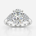 Oval-Cut Diamond Engagement Ring with Cluster Side Stones in Gold & Platinum