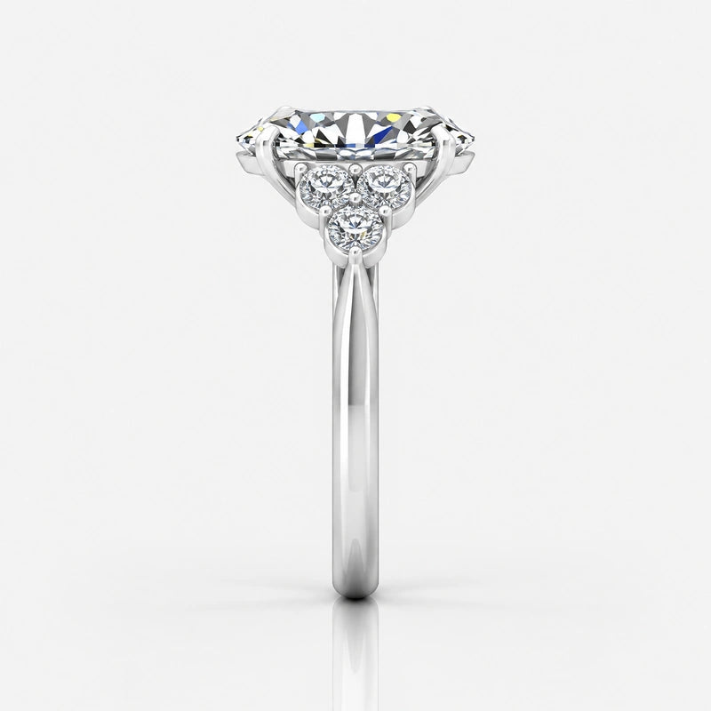 Oval-Cut Diamond Engagement Ring with Cluster Side Stones in Gold & Platinum