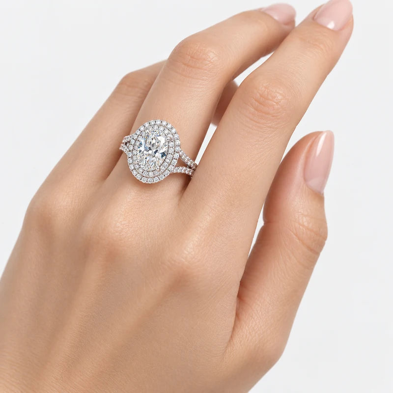 Oval-cut lab-grown diamond double halo engagement ring with pavé split shank in gold and platinum