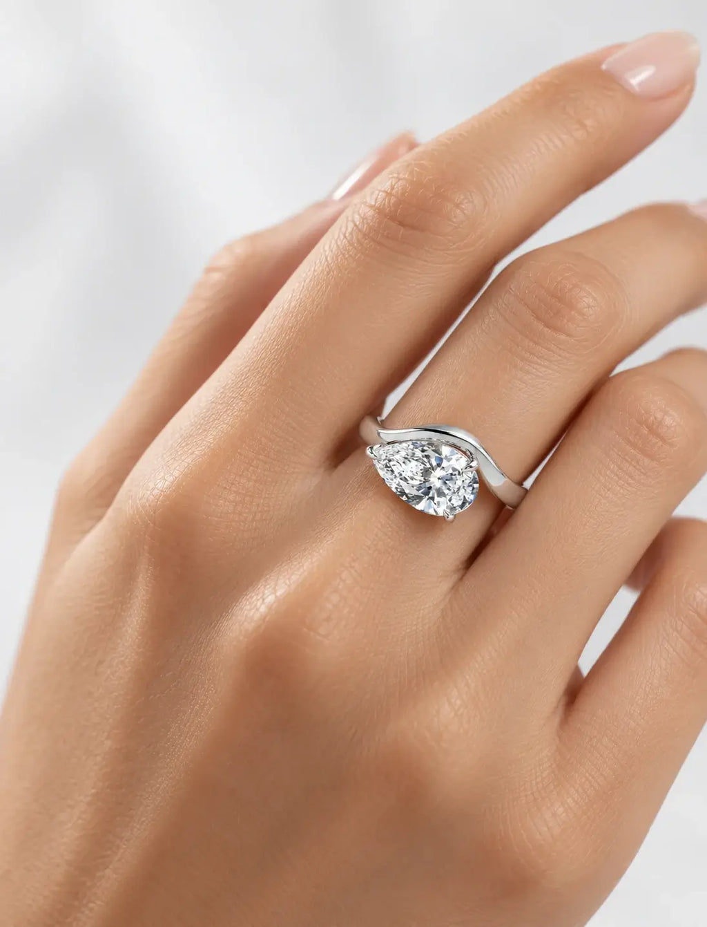 IGI Certified Lab Grown East-West Pear-Shaped Diamond Bypass Solitaire Ring in Gold & Platinum