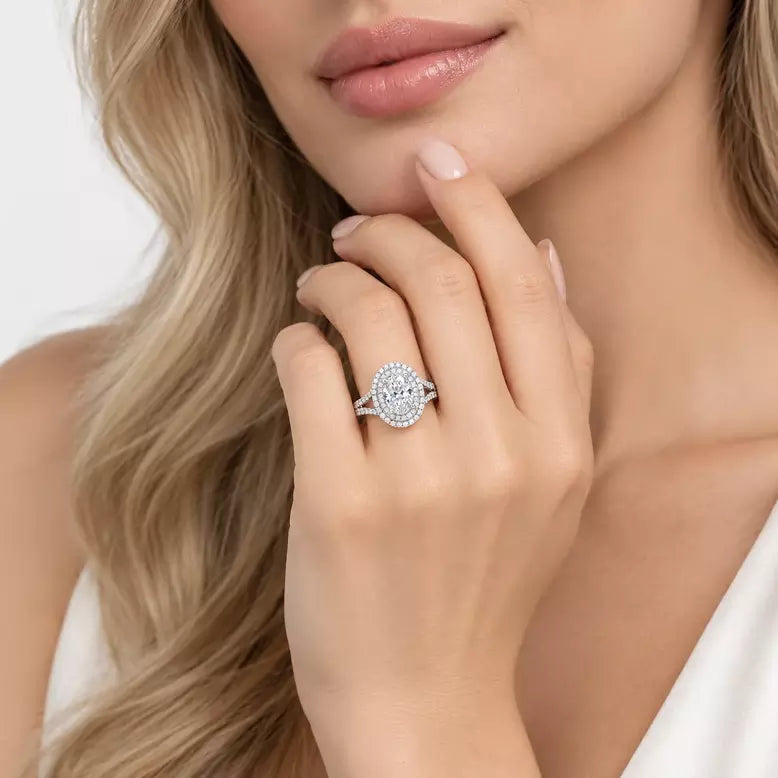 Oval-cut lab-grown diamond double halo engagement ring with pavé split shank in gold and platinum