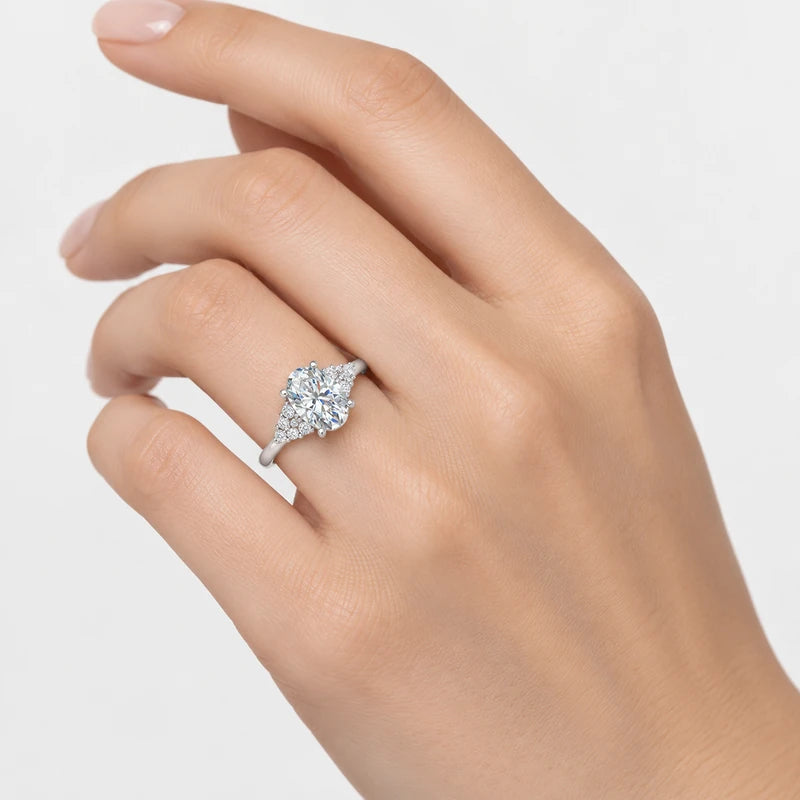 IGI Certified Oval-Cut Diamond Engagement Ring with Triangular Cluster Side Stones in Platinum & Gold