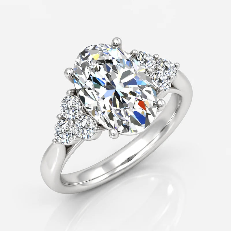 Oval-Cut Diamond Engagement Ring with Cluster Side Stones in Gold & Platinum