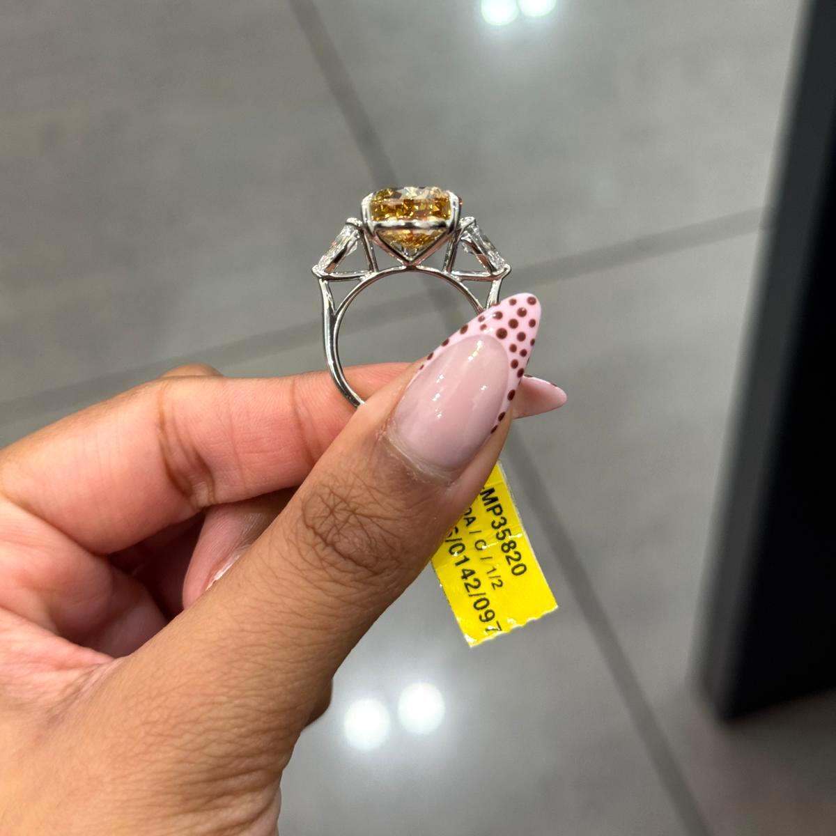 Rare Beauty: Certified 12.50ct Fancy Vivid Brownish Yellow Pear Diamond Trilogy Ring in Platinum