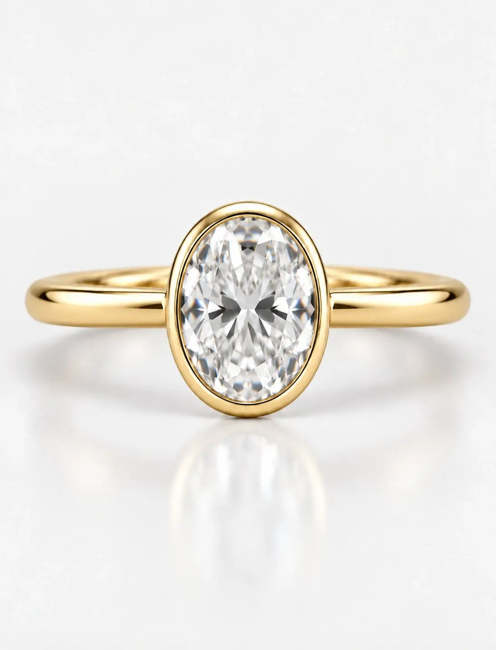 IGI Certified Lab Grown Oval Diamond Bezel Set Solitaire Engagement Ring in 18k Yellow Gold