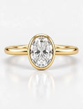 IGI Certified Lab Grown Oval Diamond Bezel Set Solitaire Engagement Ring in 18k Yellow Gold