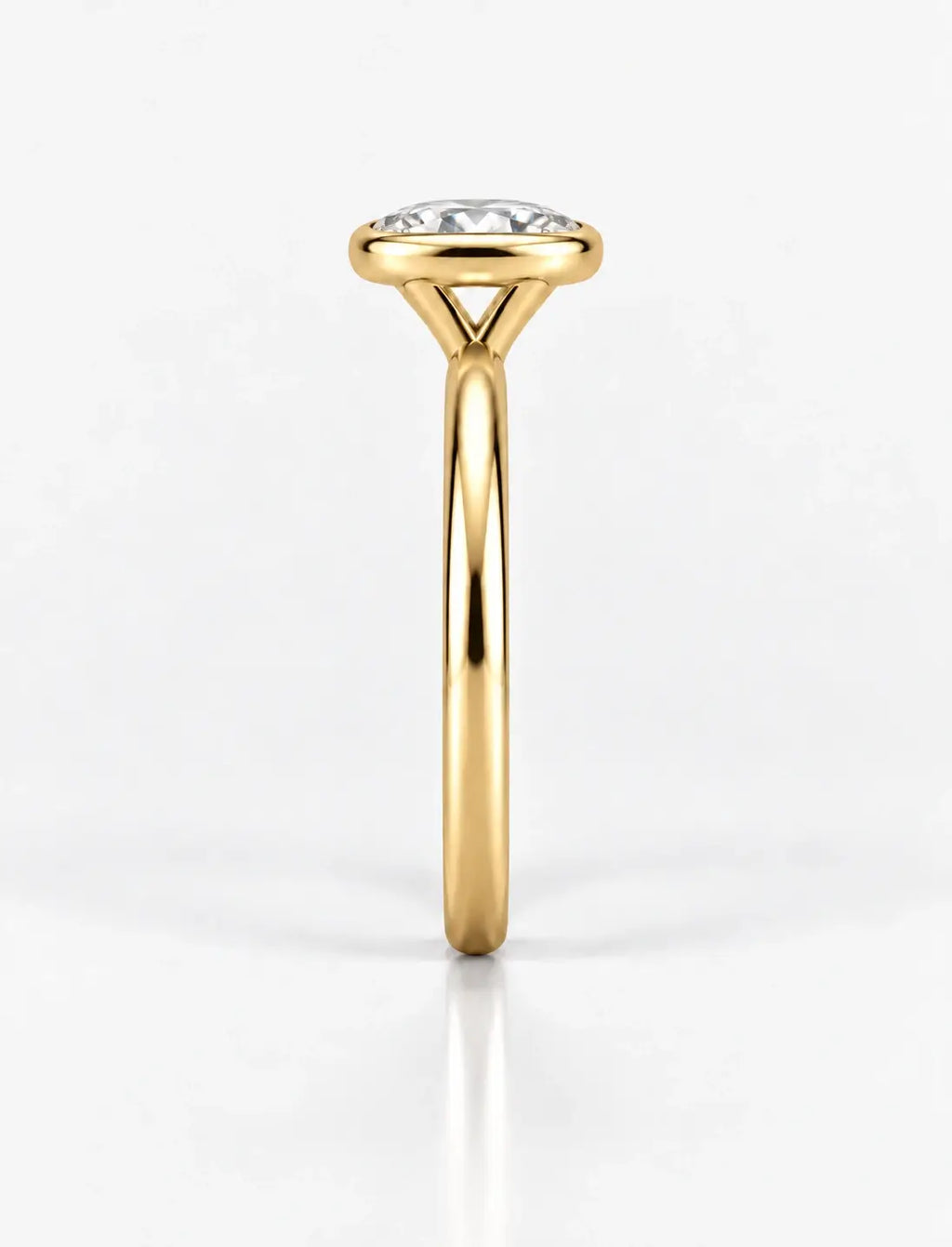 IGI Certified Lab Grown Oval Diamond Bezel Set Solitaire Engagement Ring in 18k Yellow Gold