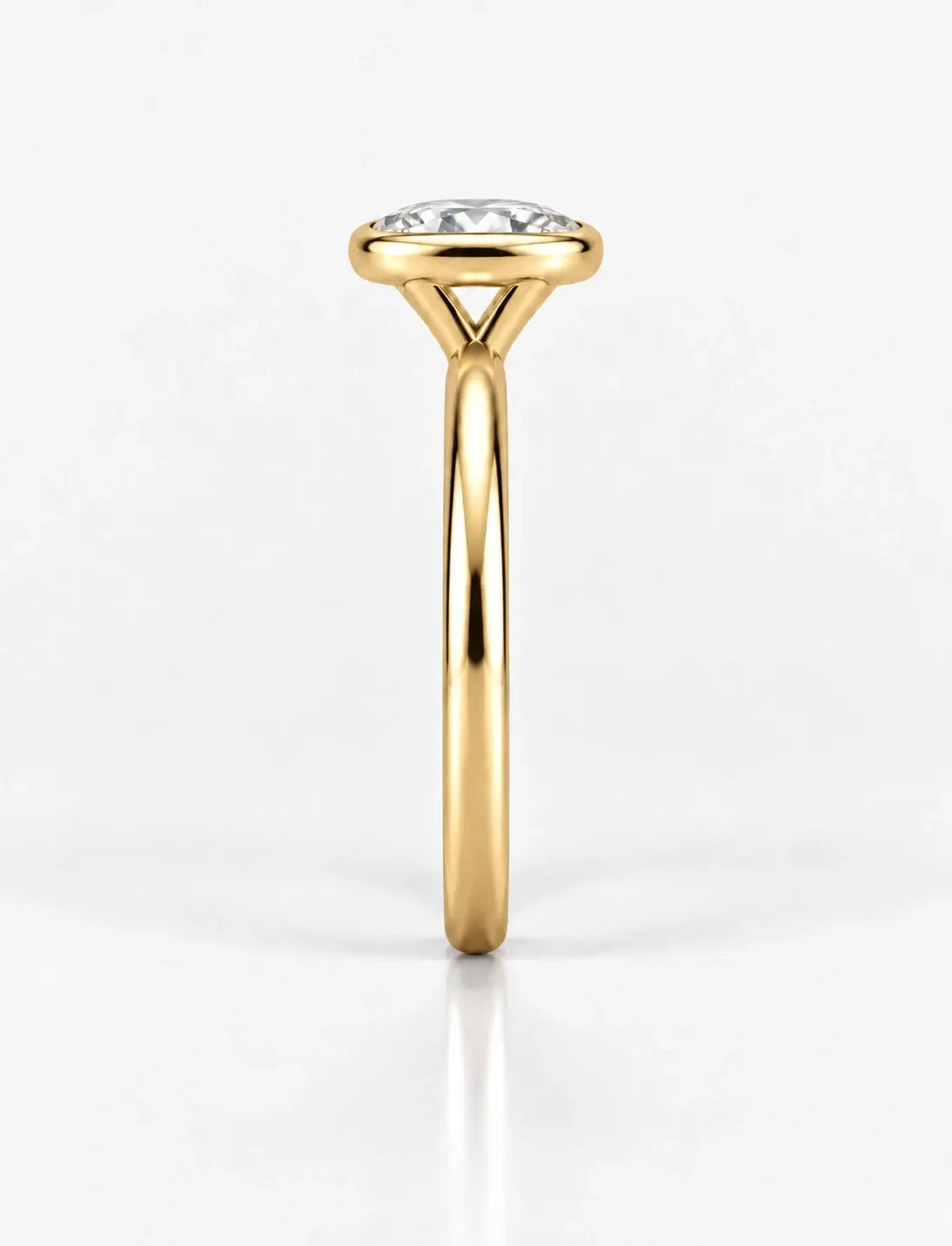 IGI Certified Lab Grown Oval Diamond Bezel Set Solitaire Engagement Ring in 18k Yellow Gold