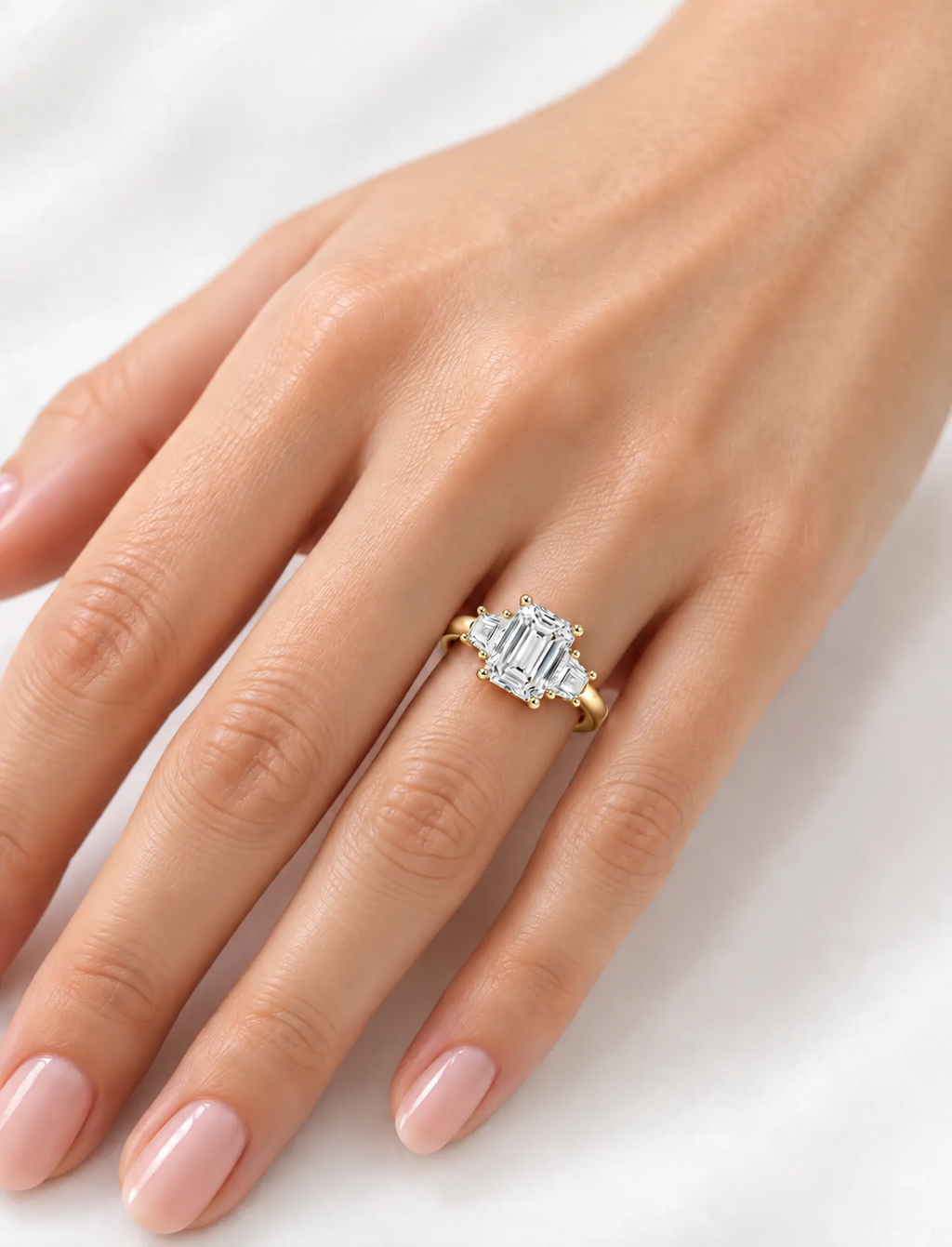 IGI Lab Grown The Classic Three-Stone Emerald Cut Diamond Engagement Ring with Trapezoid Side Stones in 18K Yellow Gold