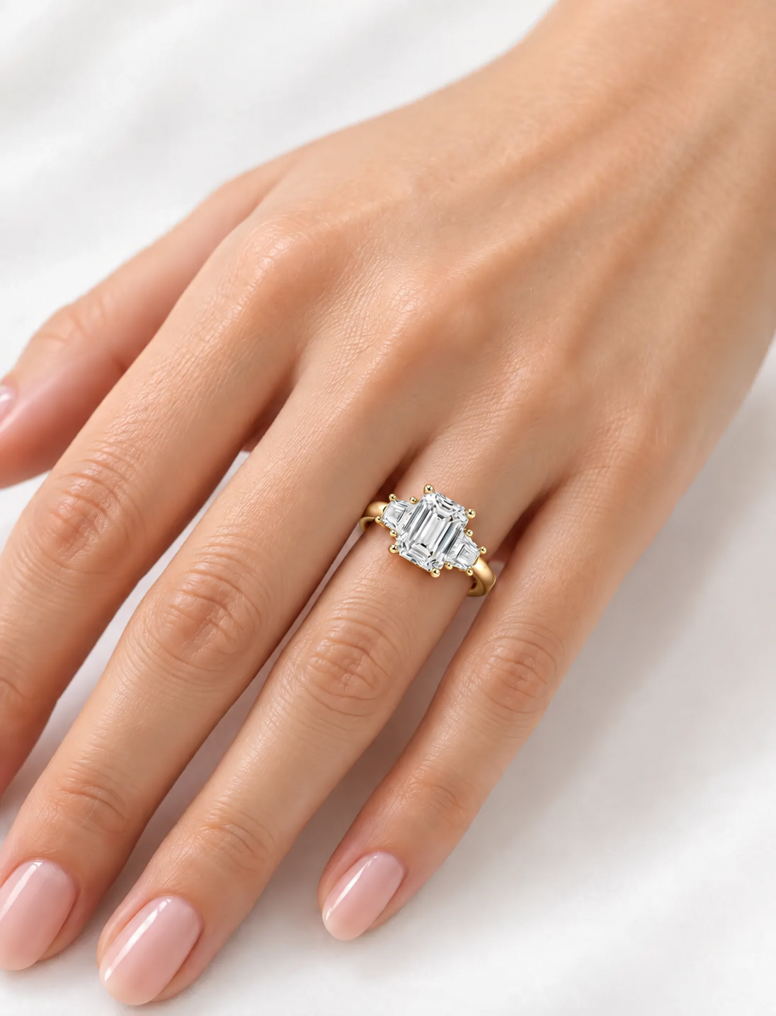 IGI Lab Grown The Classic Three-Stone Emerald Cut Diamond Engagement Ring with Trapezoid Side Stones in 18K Yellow Gold