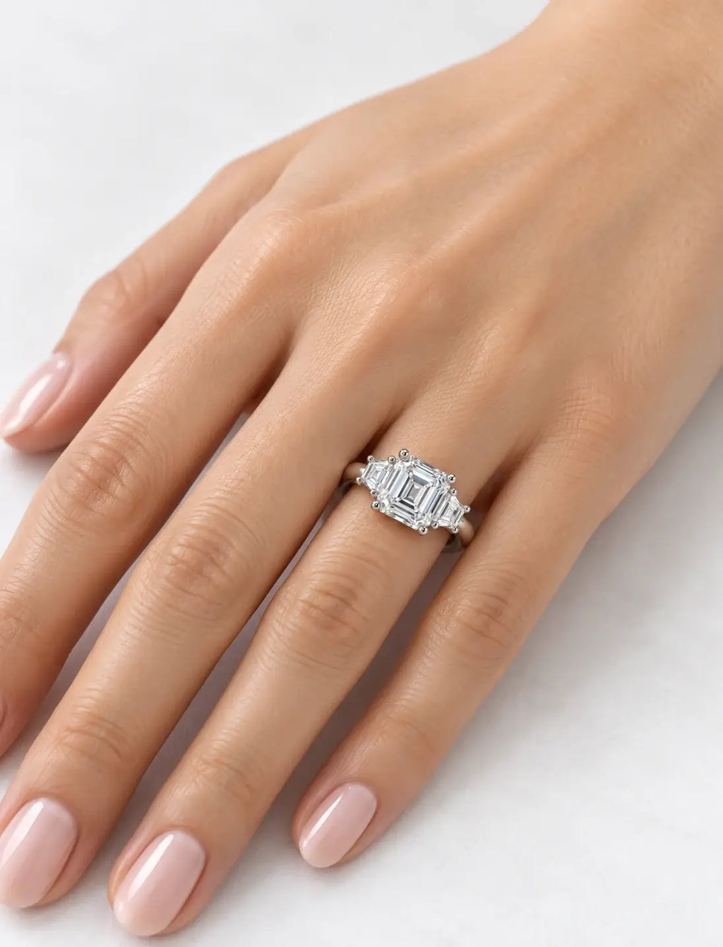 Lab Grown IGI Certified Asscher-Cut Three-Stone Ring with Trapezoid Side Stones in Gold & Platinum