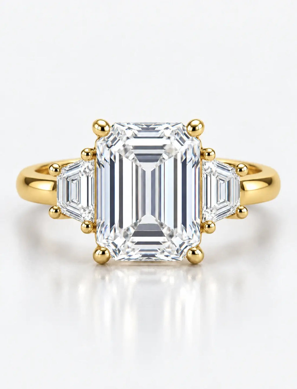 IGI Certified Lab Grown Classic Emerald-Cut Three-Stone Ring with Trapezoid Side Stones in Gold & Platinum