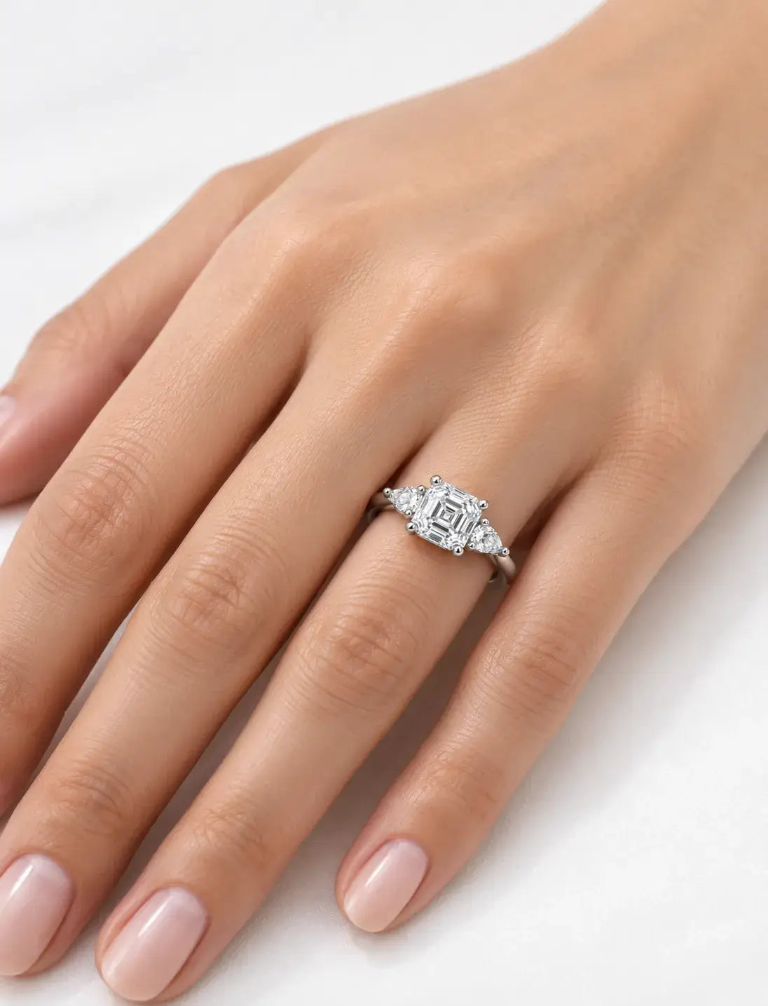 Asscher & Pear Cut Diamond Enaggement Ring in Platinum IGI Certified Lab Grown The Step-Cut Elegance Trilogy Style