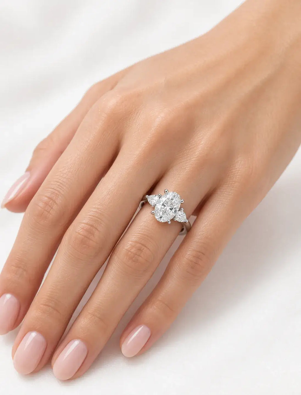 Oval Diamond Engagement Ring side Pear Trilogy Ring IGI Lab Grown in Platinum