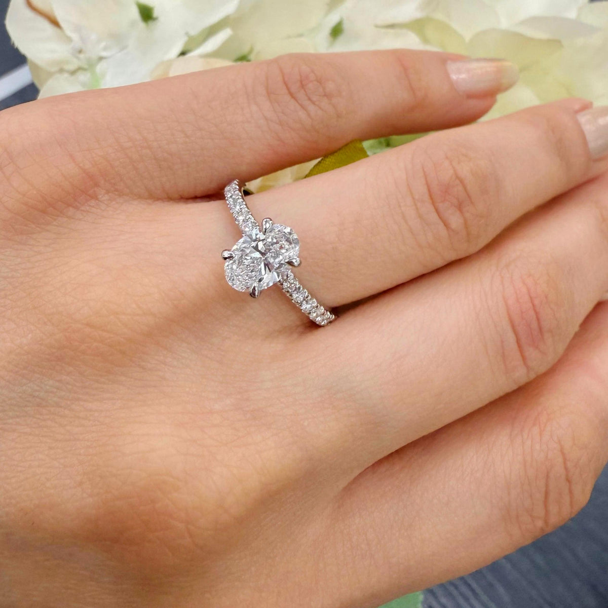 IGI Certified E/VS Oval With Side Diamond Hidden Halo Engagement Ring In Platinum