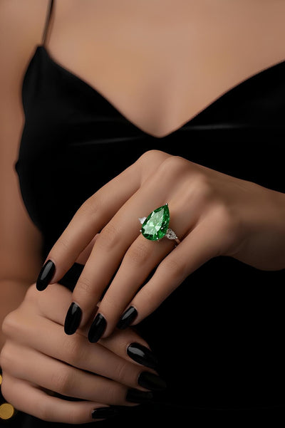 Rare Beauty: 12.00ct Fancy Vivid Green Pear Diamond Trilogy Ring in Platinum