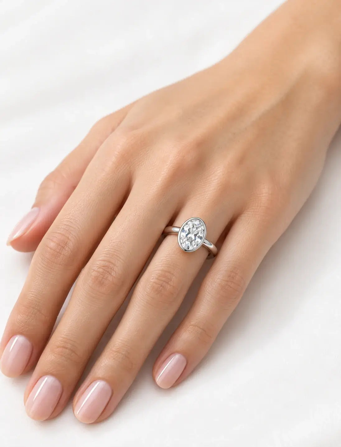 IGI Certified Lab Grown Oval Diamond Bezel Set Solitaire Engagement Ring in Platinum