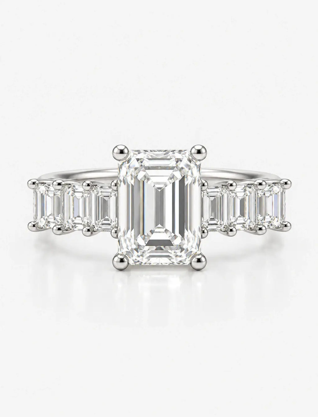 Emerald-Cut Lab Grown Diamond Engagement Ring with Prong-Set IGI Certified Emerald Side Stones in Platinum