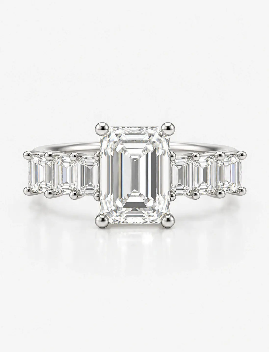 Emerald-Cut Lab Grown Diamond Engagement Ring with Prong-Set IGI Certified Emerald Side Stones in Platinum