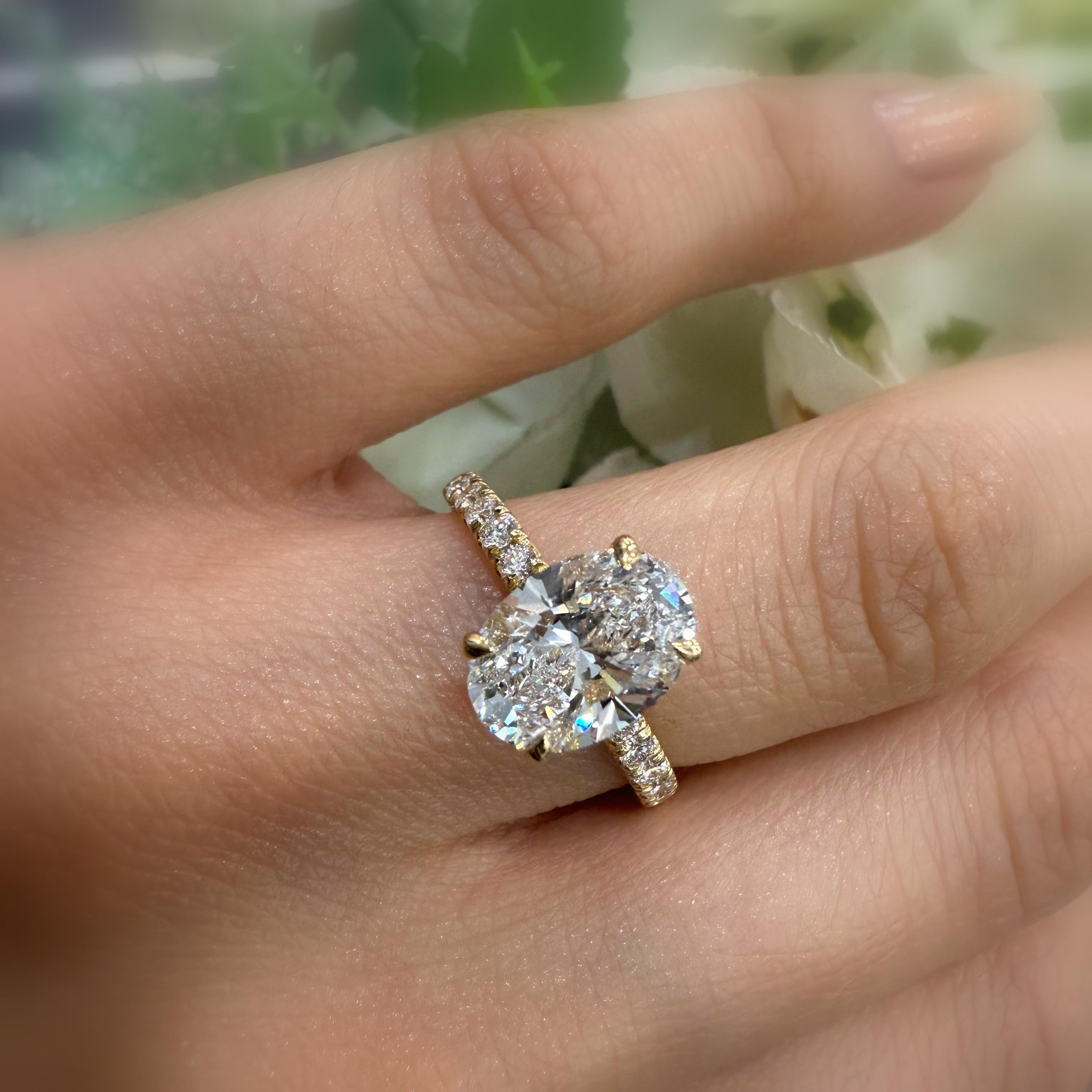 IGI Certified 2.00 Carat E/VS Oval With Side Diamond Hidden Halo Engagement Ring In 18K Yellow Gold