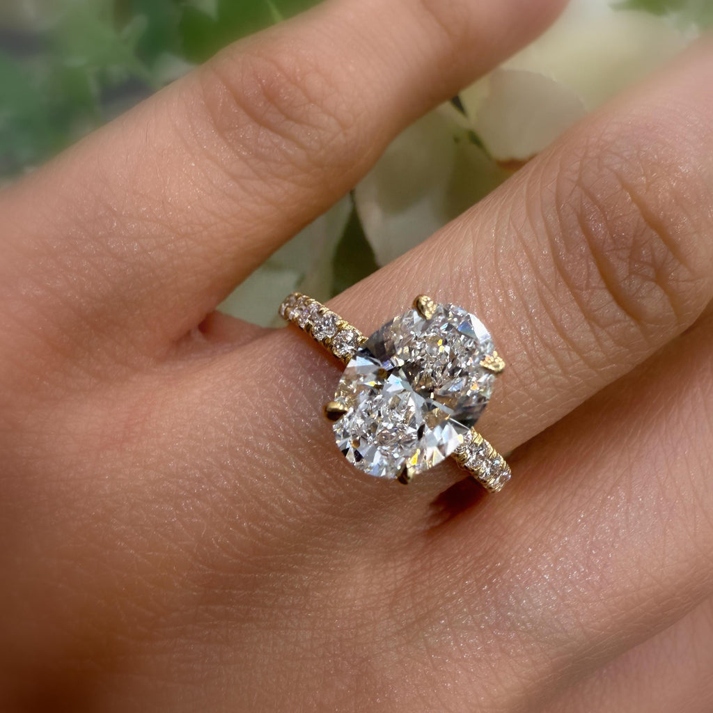IGI Certified 2.00 Carat E/VS Oval With Side Diamond Hidden Halo Engagement Ring In 18K Yellow Gold