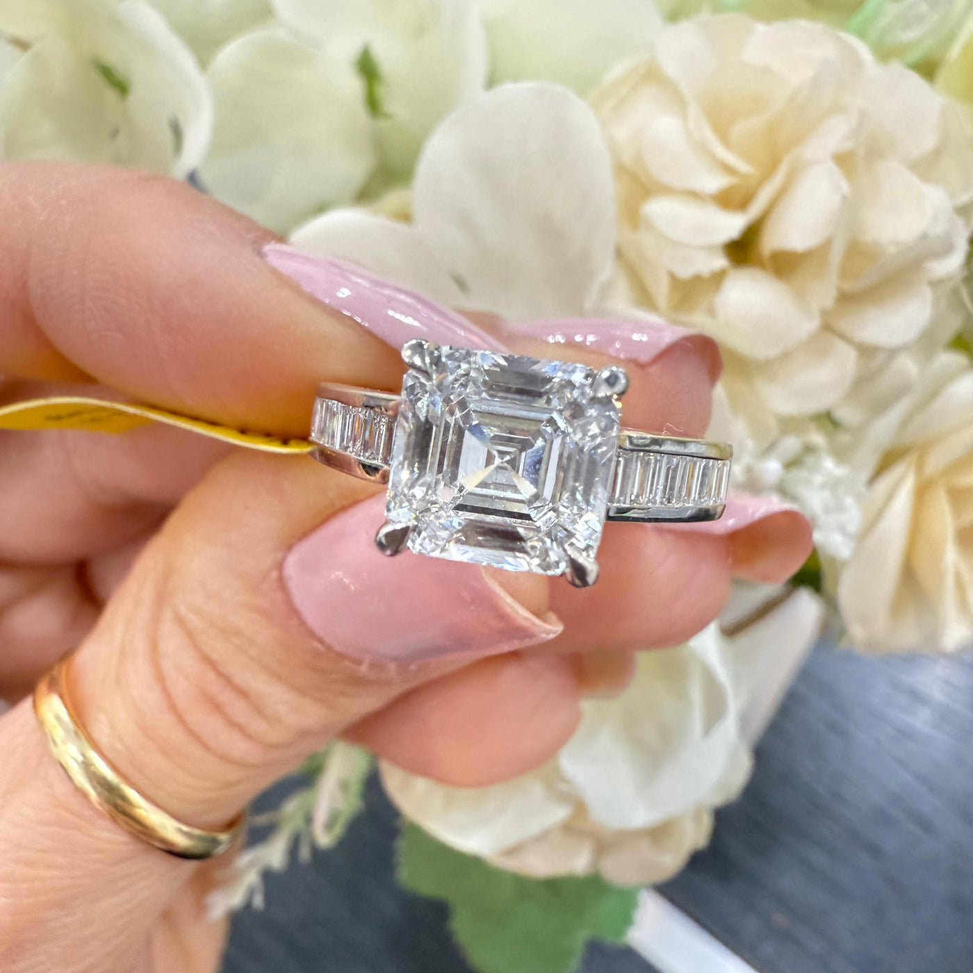 Close-up of IGI Certified Asscher Cut Lab Diamond Ring with Baguette Sides