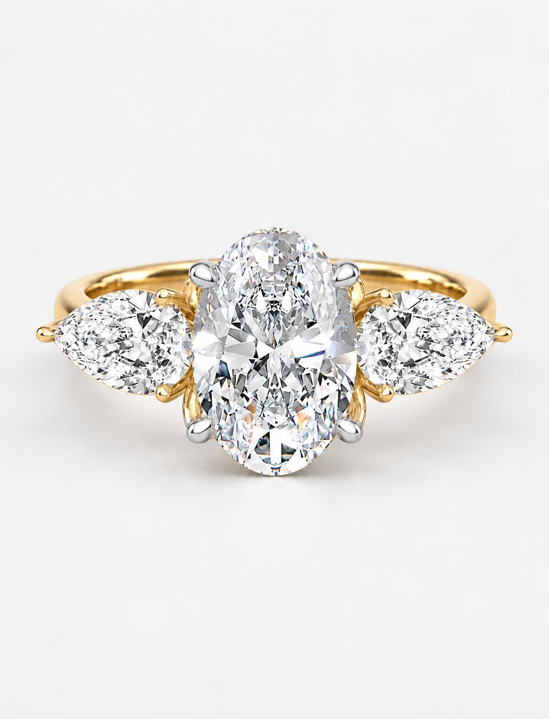 IGI Certified Lab Grown Oval Cut Three-Stone Diamond Engagement Ring with Pear Side Stones in Gold & Platinum