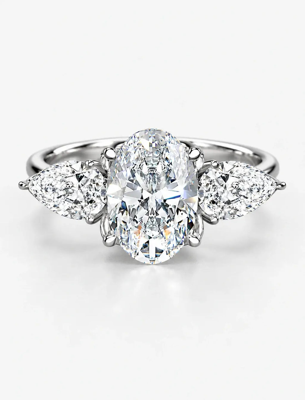 IGI Certified Lab Grown Oval Cut Three-Stone Diamond Engagement Ring with Pear Side Stones in Gold & Platinum