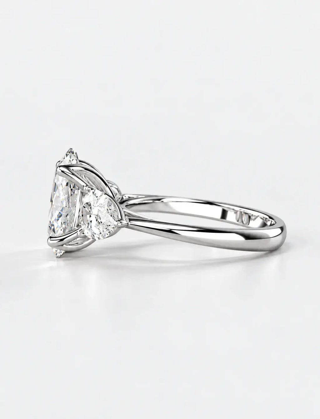 IGI Certified Lab Grown Oval Cut Three-Stone Diamond Engagement Ring with Pear Side Stones in Gold & Platinum