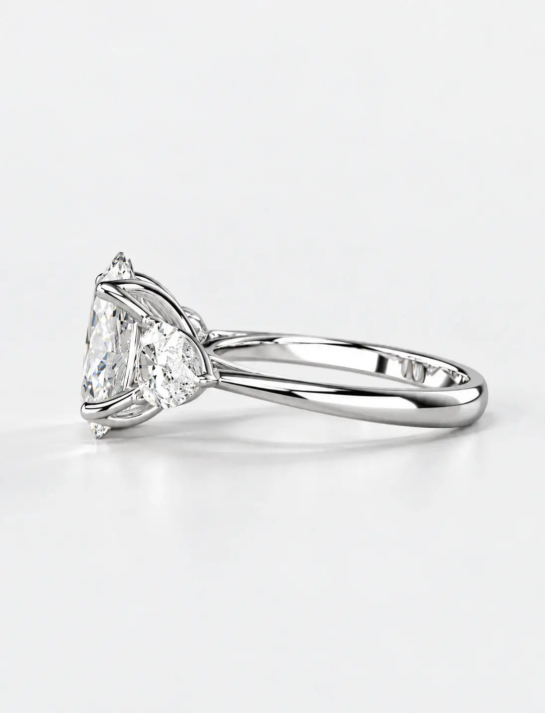 IGI Certified Lab Grown Oval Cut Three-Stone Diamond Engagement Ring with Pear Side Stones in Gold & Platinum